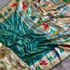 Multicoloured soft silk saree with golden zari border and floral woven design for women festive wear