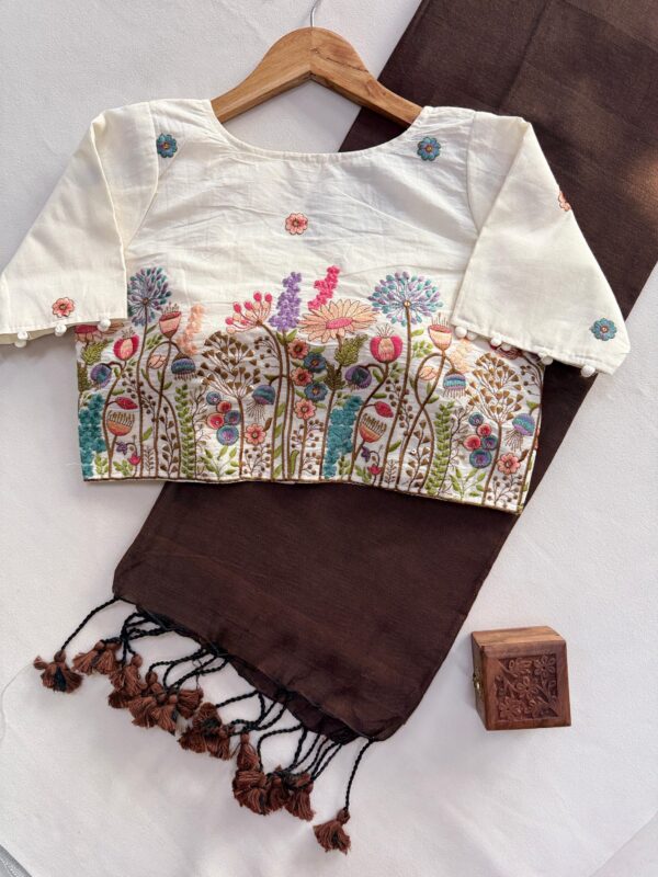 khadi cotton saree paired with a white embroidered readymade blouse. for women festive wear