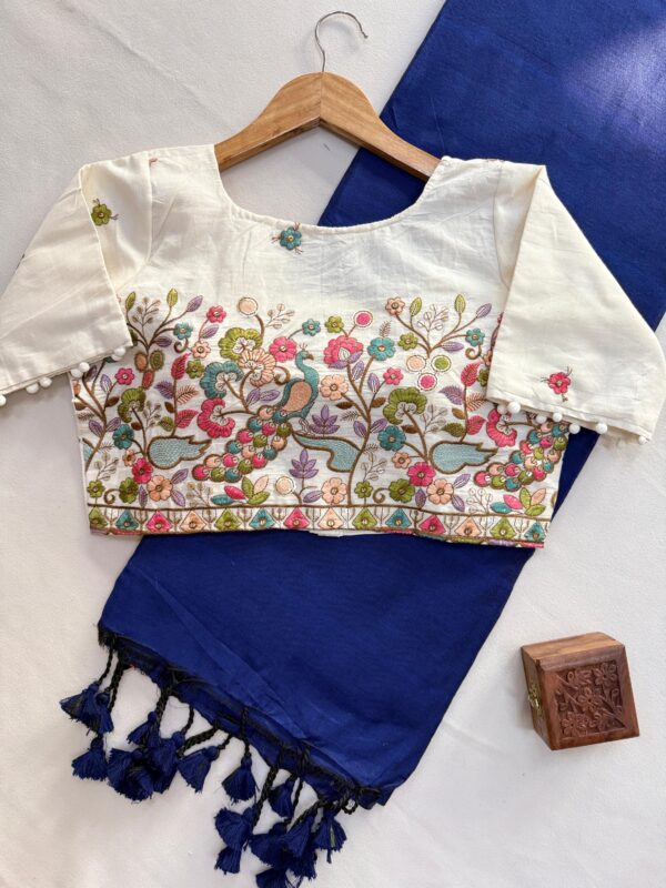 khadi cotton saree paired with a white embroidered readymade blouse. for women festive wear