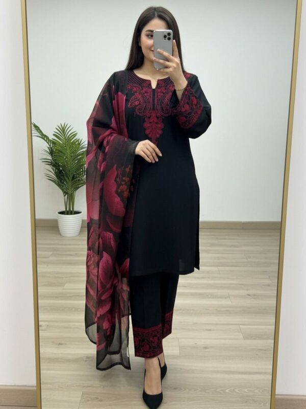 Woman wearing black kurta with red embroidery and matching printed dupatta, paired with black pants for women festive wear