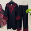 Woman wearing black kurta with red embroidery and matching printed dupatta, paired with black pants for women festive wear