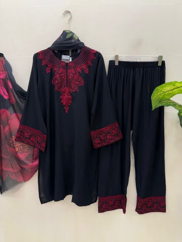Woman wearing black kurta with red embroidery and matching printed dupatta, paired with black pants for women festive wear