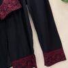 Woman wearing black kurta with red embroidery and matching printed dupatta, paired with black pants for women festive wear