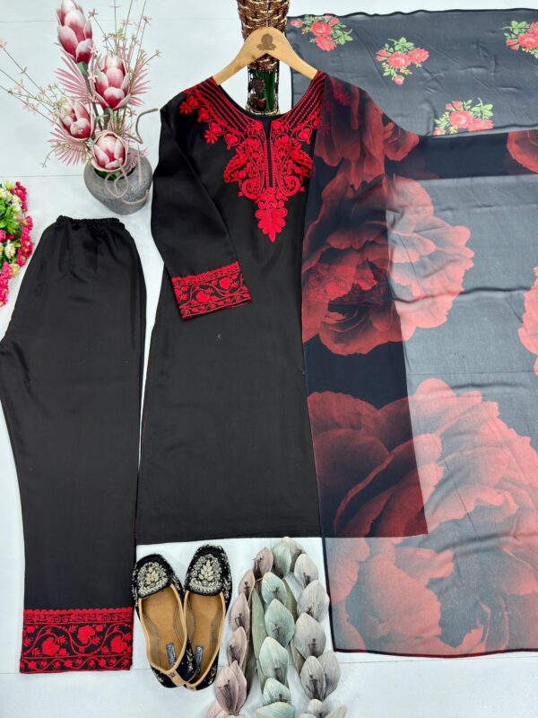 Woman wearing black kurta with red embroidery and matching printed dupatta, paired with black pants for women festive wear