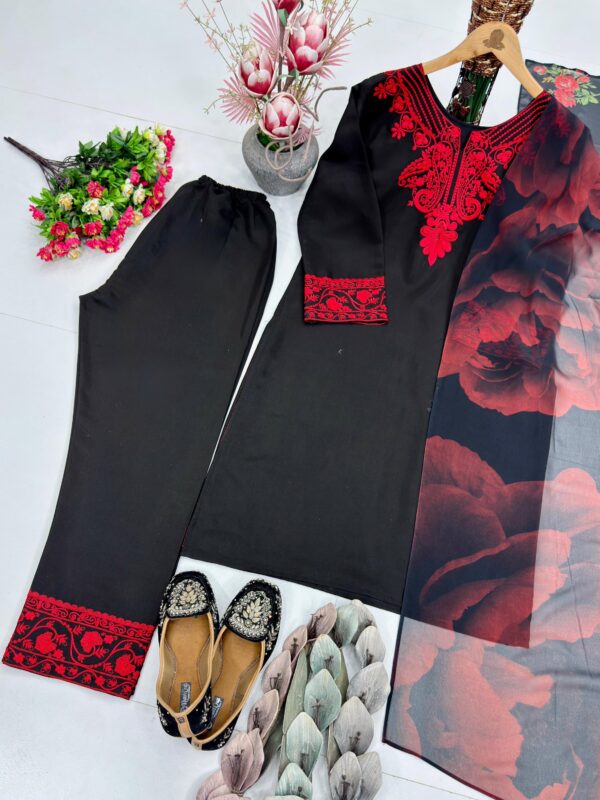 Woman wearing black kurta with red embroidery and matching printed dupatta, paired with black pants for women festive wear